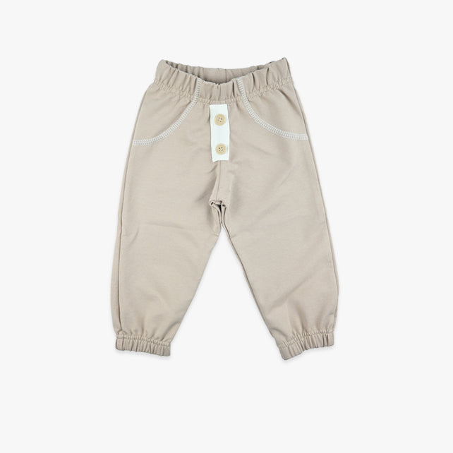 Donji dio za bebe dječake Tiny Buttons – pamučne hlačice s dugmićima u krem boji